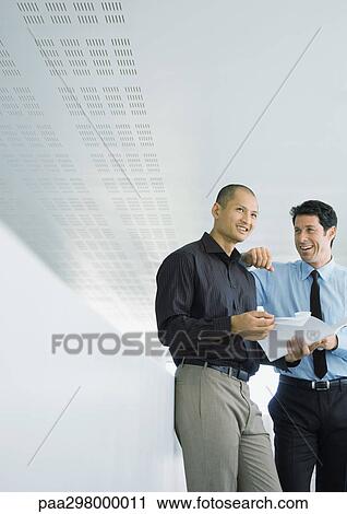 Two businessmen smiling View Large Photo Image Stock Image - Two businessmen smiling. Fotosearch