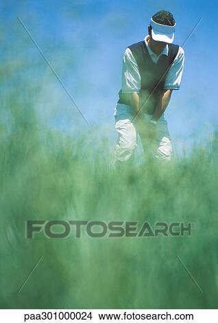 Golfer preparing to swing View Large Photo Image Picture - Golfer preparing to swing. Fotosearch