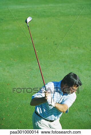 Golfer swinging View Large Photo Image Picture - Golfer swinging. Fotosearch
