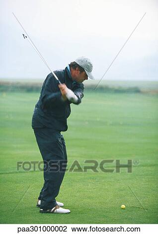 Golfer swinging View Large Photo Image Stock Image - Golfer swinging. Fotosearch