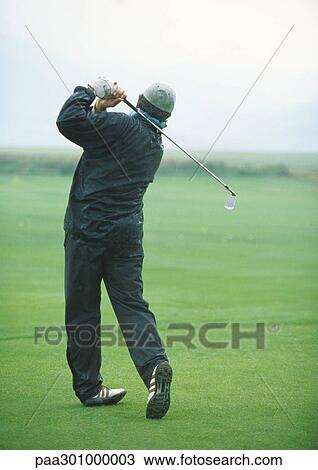 Golfer swinging View Large Photo Image Stock Image - Golfer swinging. Fotosearch