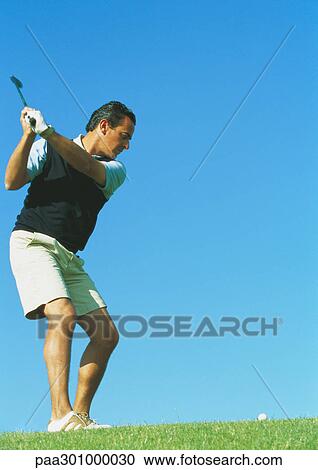 Golfer swinging View Large Photo Image Stock Image - Golfer swinging. Fotosearch
