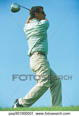 Golfer swinging View Large Photo Image Stock Image - Golfer swinging. Fotosearch