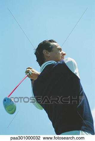 Golfer swinging View Large Photo Image Stock Image - Golfer swinging. Fotosearch