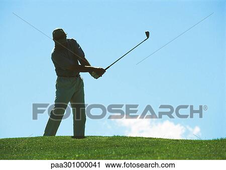 Stock Image - Golfer swinging. Fotosearch