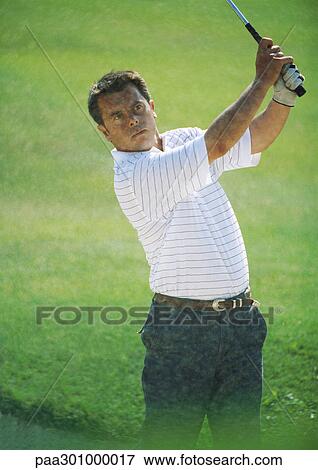 Golfer swinging View Large Photo Image Stock Photo - Golfer swinging. Fotosearch