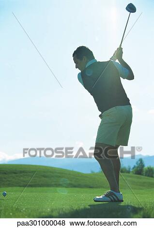 Golfer swinging View Large Photo Image Stock Photo - Golfer swinging. Fotosearch