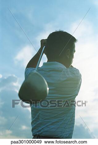 Golfer swinging View Large Photo Image Stock Photo - Golfer swinging. Fotosearch