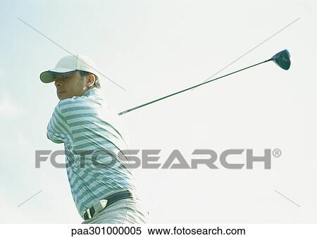 Golfer swinging View Large Photo Image Stock Photography - Golfer swinging. Fotosearch