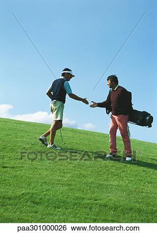 Golfers shaking hands View Large Photo Image Stock Photograph - Golfers shaking hands. Fotosearch