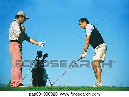 Man taking lessons with golf instructor View Large Photo Image Stock Image - Man taking lessons with golf instructor. Fotosearch