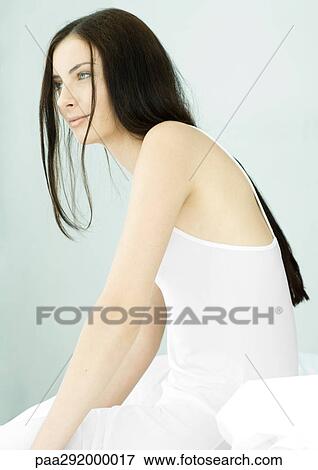 Young woman with long hair, side view View Large Photo Image Stock Photo - Young woman with long hair, side view. Fotosearch