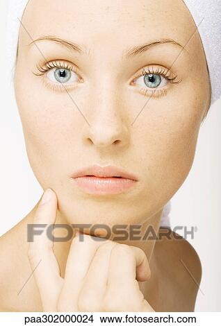Woman touching face, portrait View Large Photo Image Picture - Woman touching face, portrait. Fotosearch