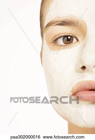 Woman with facial mask, extreme close-up View Large Photo Image Stock Photograph - Woman with facial mask, extreme close-up. Fotosearch