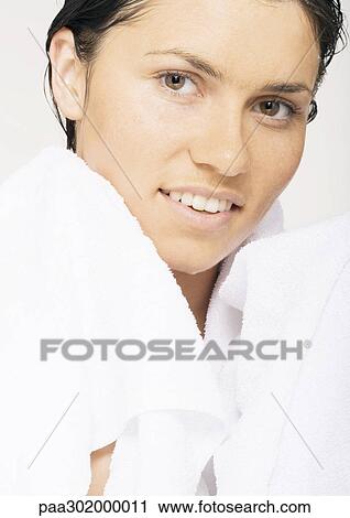 Woman with towel around neck View Large Photo Image Stock Image - Woman with towel around neck. Fotosearch