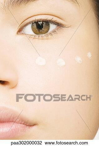 Woman's face with concealer under eye, close-up View Large Photo Image Stock Image - Woman's face with concealer under eye, close-up. Fotosearch