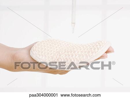 Dropper and woman's hand holding sponge View Large Photo Image Stock Image - Dropper and woman's hand holding sponge. Fotosearch