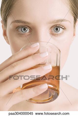 Woman drinking tea, close-up View Large Photo Image Stock Photography - Woman drinking tea, close-up. Fotosearch