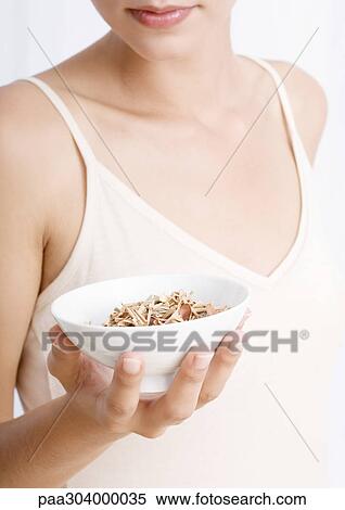 Woman holding bowl of potpourri View Large Photo Image Stock Photography - Woman holding bowl of potpourri. Fotosearch