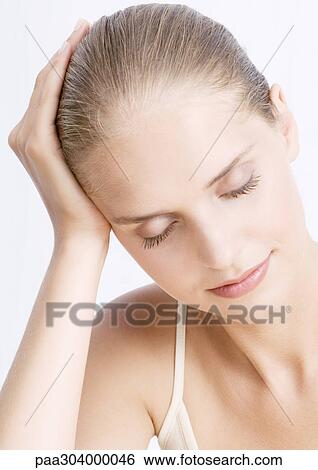 Woman leaning head against hand, eyes closed View Large Photo Image Stock Photograph - Woman leaning head against hand, eyes closed. Fotosearch