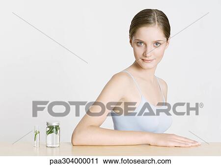 Woman with herbal tinctures View Large Photo Image Stock Image - Woman with herbal tinctures. Fotosearch