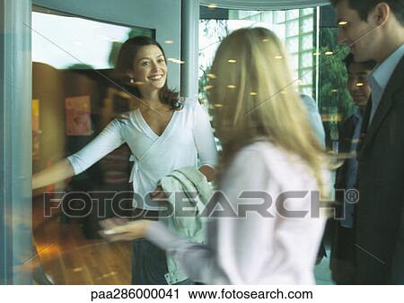 Group of businesspeople about to enter building View Large Photo Image Stock Image - Group of businesspeople about to enter building. Fotosearch
