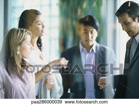 Group of businesspeople checking time View Large Photo Image Stock Photo - Group of businesspeople checking time. Fotosearch