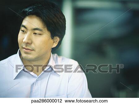 Man in button down shirt View Large Photo Image Stock Image - Man in button down shirt. Fotosearch