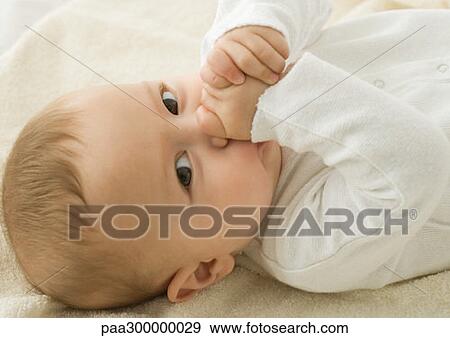 Baby sucking thumb View Large Photo Image Stock Photo - Baby sucking thumb. Fotosearch