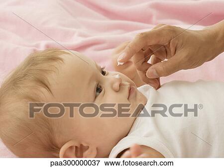 Baby with dab of lotion on nose View Large Photo Image Stock Photo - Baby with dab of lotion on nose. Fotosearch