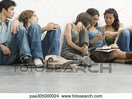 Group of students sitting on the floor View Large Photo Image Picture - Group of students sitting on the floor. Fotosearch