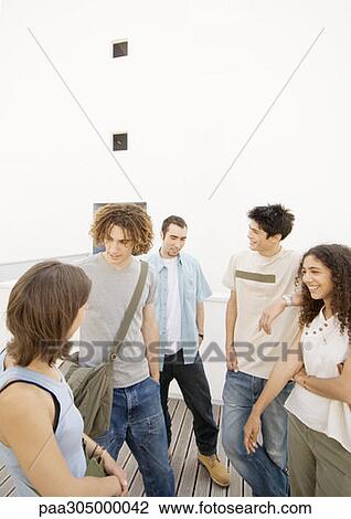Group of students standing around View Large Photo Image Stock Image - Group of students standing around. Fotosearch