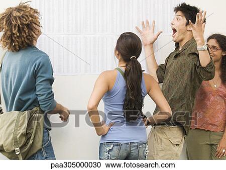 Students looking at results posted on wall, one shouting with joy View Large Photo Image Stock Image - Students looking at results posted on wall, one shouting with joy. Fotosearch