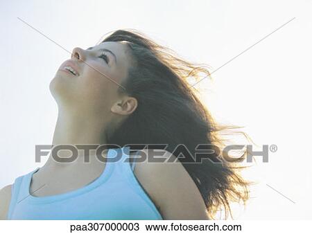 Girl with head back and wind in hair View Large Photo Image Stock Image - Girl with head back and wind in hair. Fotosearch