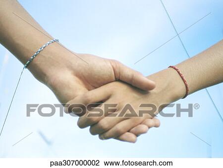 Holding hands View Large Photo Image Stock Image - Holding hands. Fotosearch