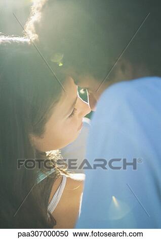Teenage couple about to kiss View Large Photo Image Stock Image - Teenage couple about to kiss. Fotosearch