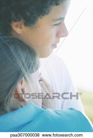 Teenage couple, girl leaning on boy's chest View Large Photo Image Stock Photo - Teenage couple, girl leaning on boy's chest. Fotosearch