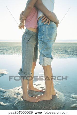 Two children standing on beach, embracing View Large Photo Image Stock Photo - Two children standing on beach, embracing. Fotosearch