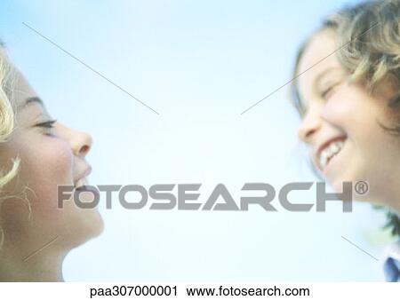 Two girls laughing View Large Photo Image Stock Image - Two girls laughing. Fotosearch