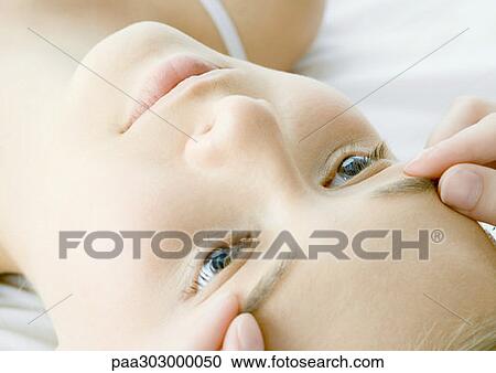 Stock Image - Woman having face massage. Fotosearch