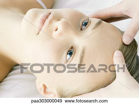 Woman having head massage View Large Photo Image Stock Photo - Woman having head massage. Fotosearch