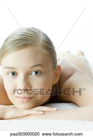 Stock Image - Woman resting head on hands, portrait. Fotosearch