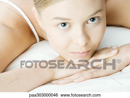Woman resting head on hands View Large Photo Image Stock Photograph - Woman resting head on hands. Fotosearch