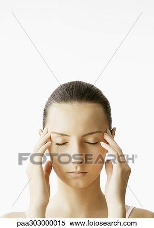 Woman with fingers on temples View Large Photo Image Stock Photography - Woman with fingers on temples. Fotosearch
