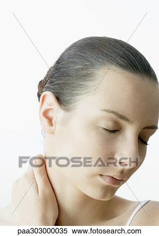 Woman with hand on neck and eyes closed View Large Photo Image Stock Photography - Woman with hand on neck and eyes closed. Fotosearch