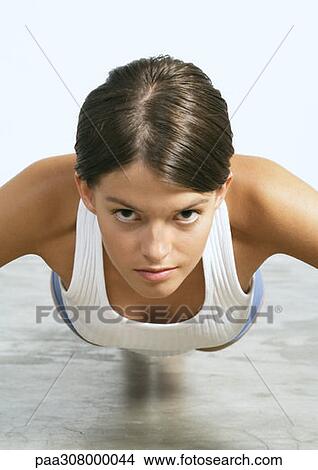 Woman doing push-ups View Large Photo Image Picture - Woman doing push-ups. Fotosearch