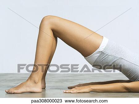 Woman doing shoulder bridge, chest down View Large Photo Image Stock Image - Woman doing shoulder bridge, chest down. Fotosearch