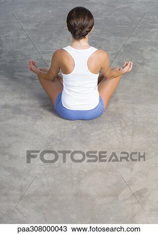 Woman sitting in lotus position on floor View Large Photo Image Stock Image - Woman sitting in lotus position on floor. Fotosearch