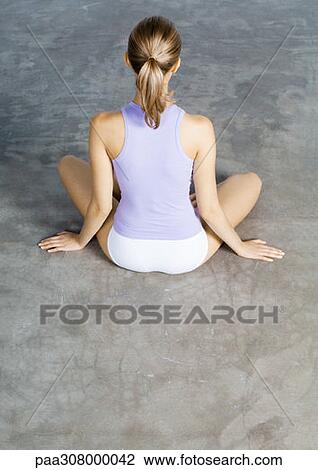 Woman sitting indian style on floor, rear view View Large Photo Image Stock Image - Woman sitting indian style on floor, rear view. Fotosearch