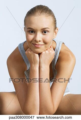 Woman sitting, leaning on elbows View Large Photo Image Stock Photo - Woman sitting, leaning on elbows. Fotosearch